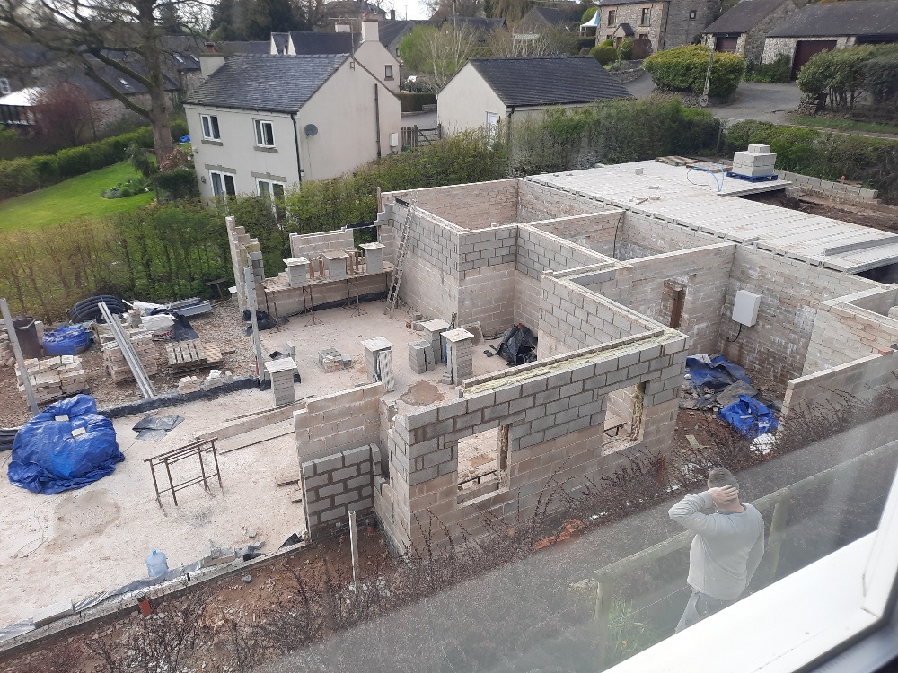 Rebuild up to back door and put blockes in parking area